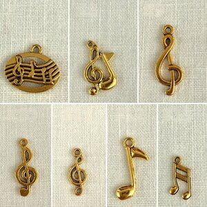 Gold Tone Set of 7 Music Charms Treble Clefs and Music Notes Crafting Jewelry